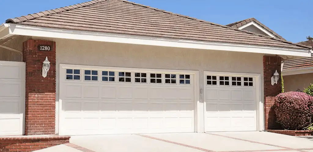 Residential garage door repair service for a double garage door in Columbia, MO