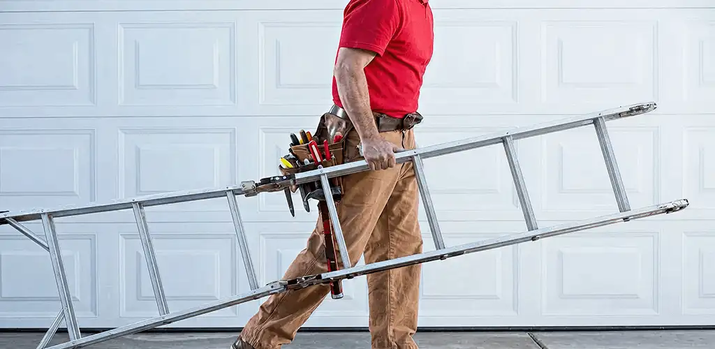 Garage door repair technician arriving with tools and ladder in Columbia, MO