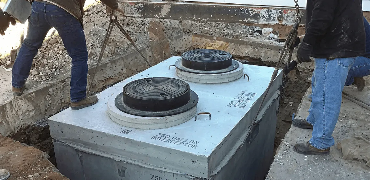 Grease trap installation for a commercial property drainage system in Columbia, MO