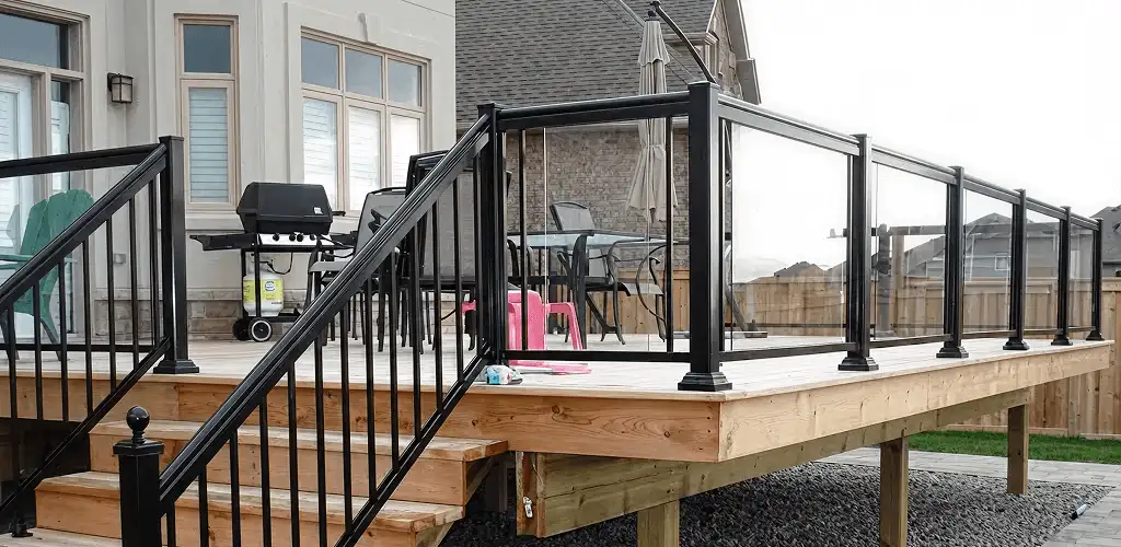 Handrail installation on a deck staircase for safety and code compliance in Columbia, MO
