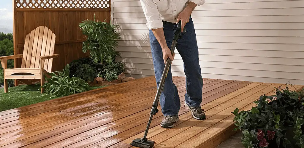 Deck staining service applying stain to a backyard wood deck in Columbia, MO
